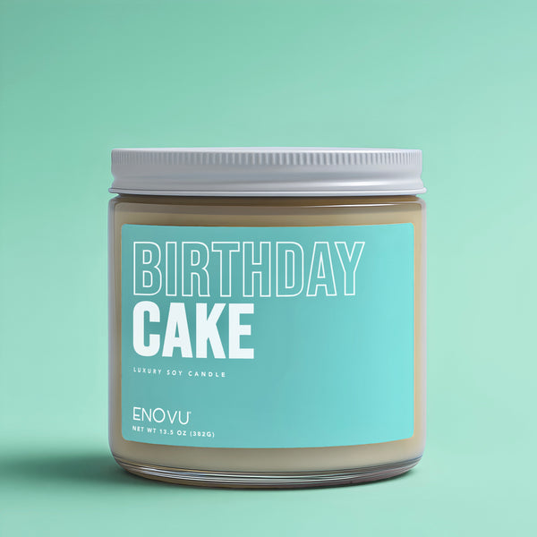 Candle jar labeled 'Birthday Cake' by ENOVU on a light green background
